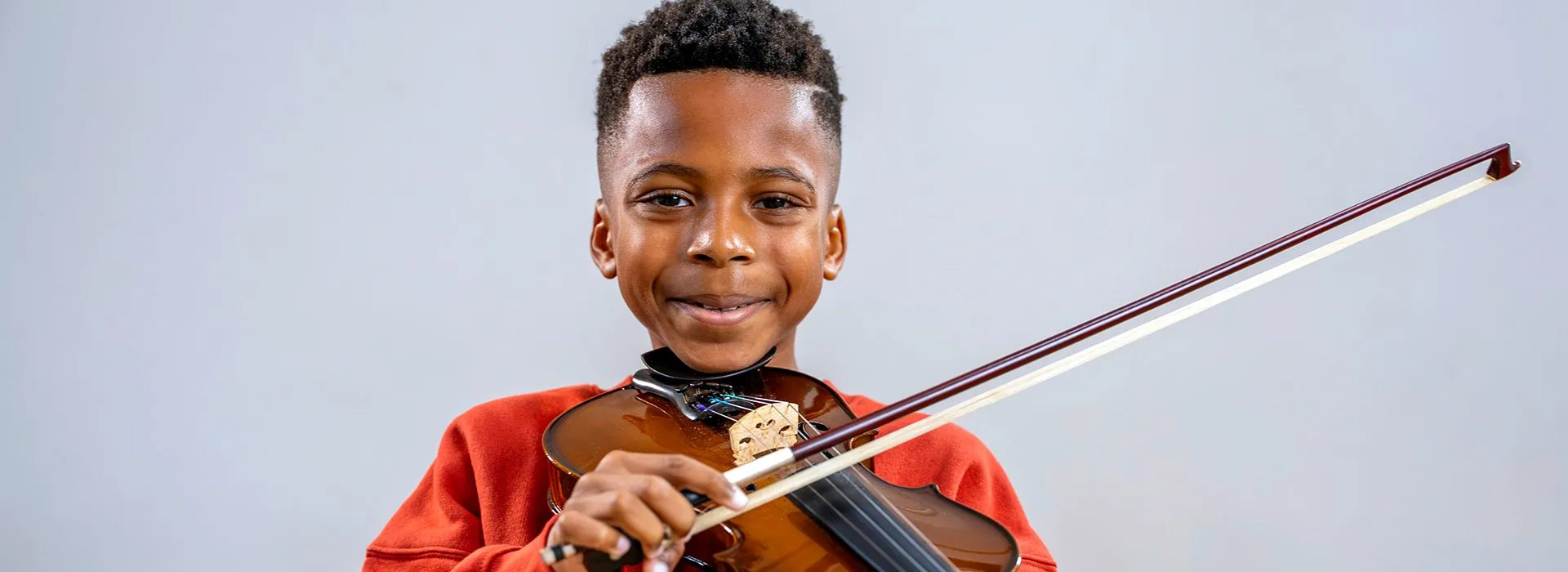 boy playing violin