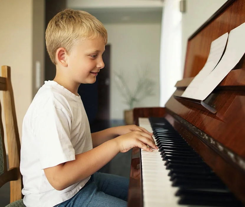 boy playing piano