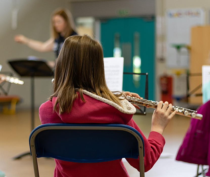 girl playing a flute
