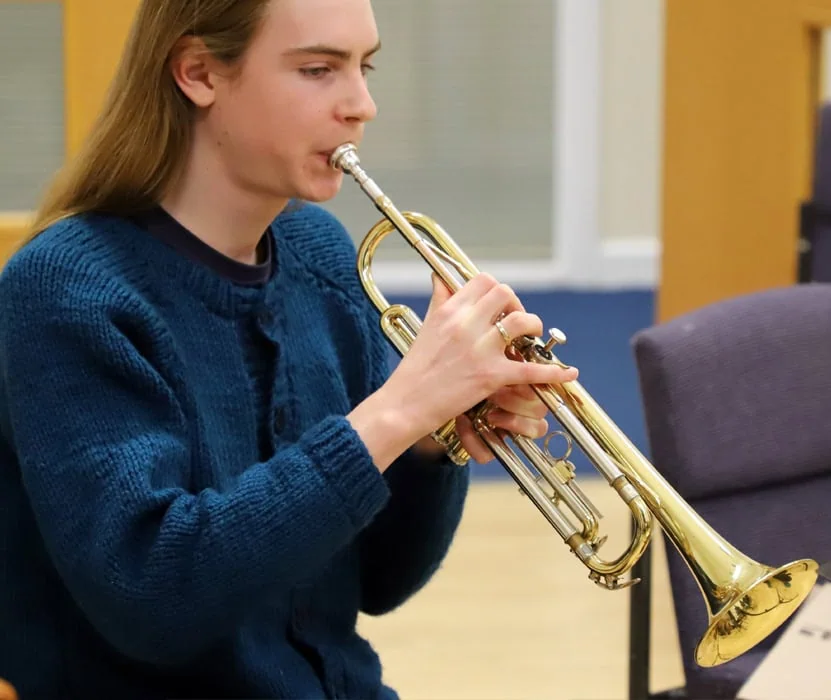 boy playing trumpet