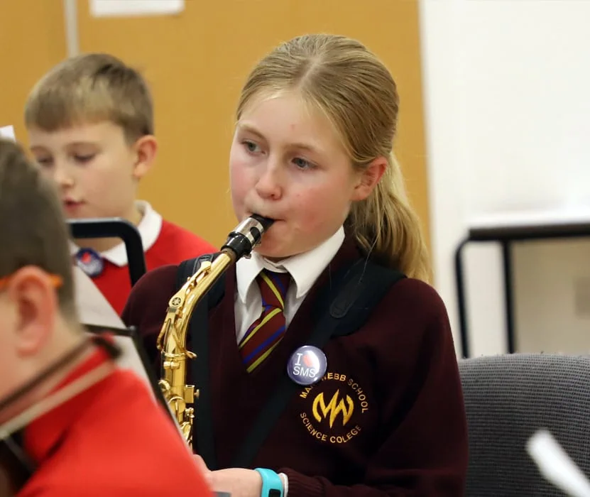 girl playing the saxophone
