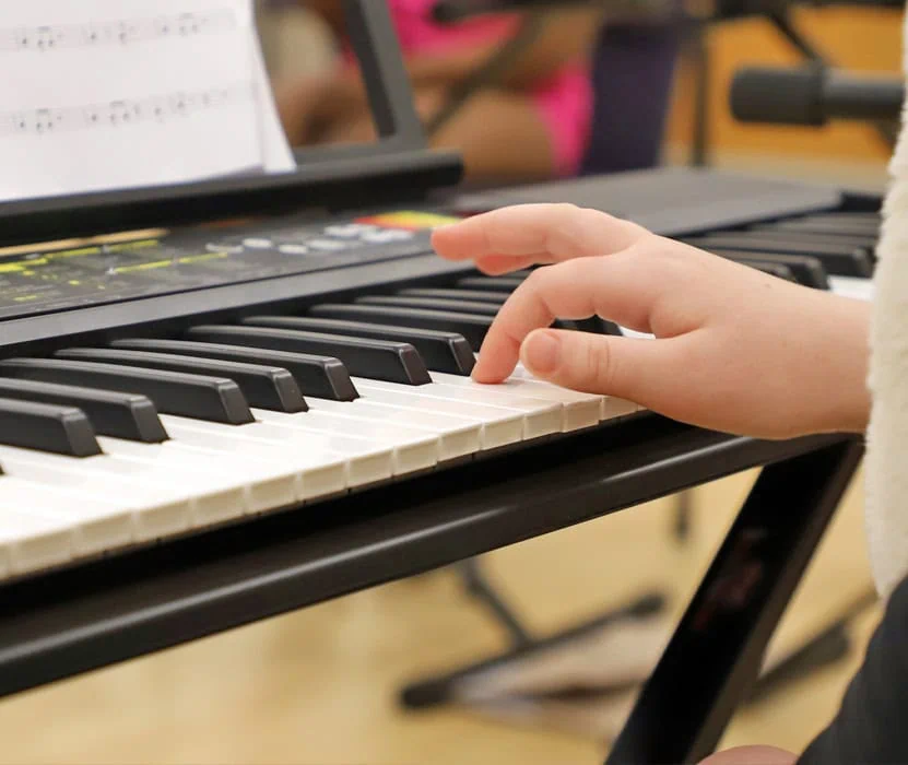 child playing a piano