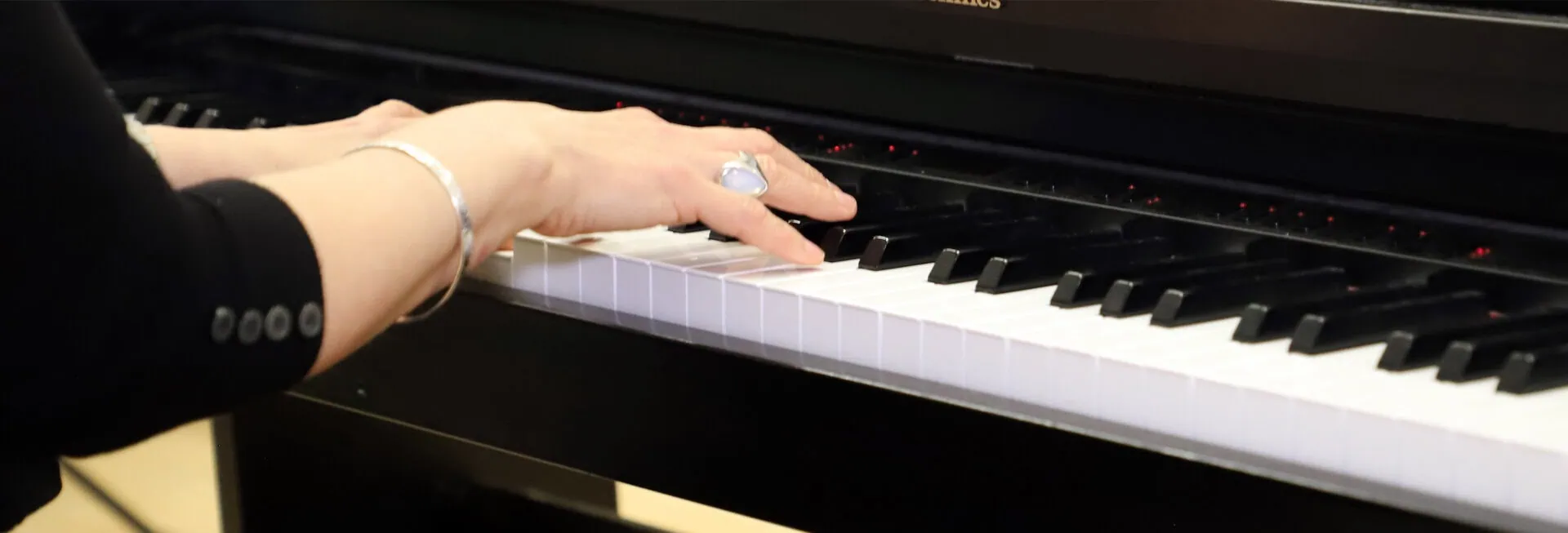 teacher playing piano