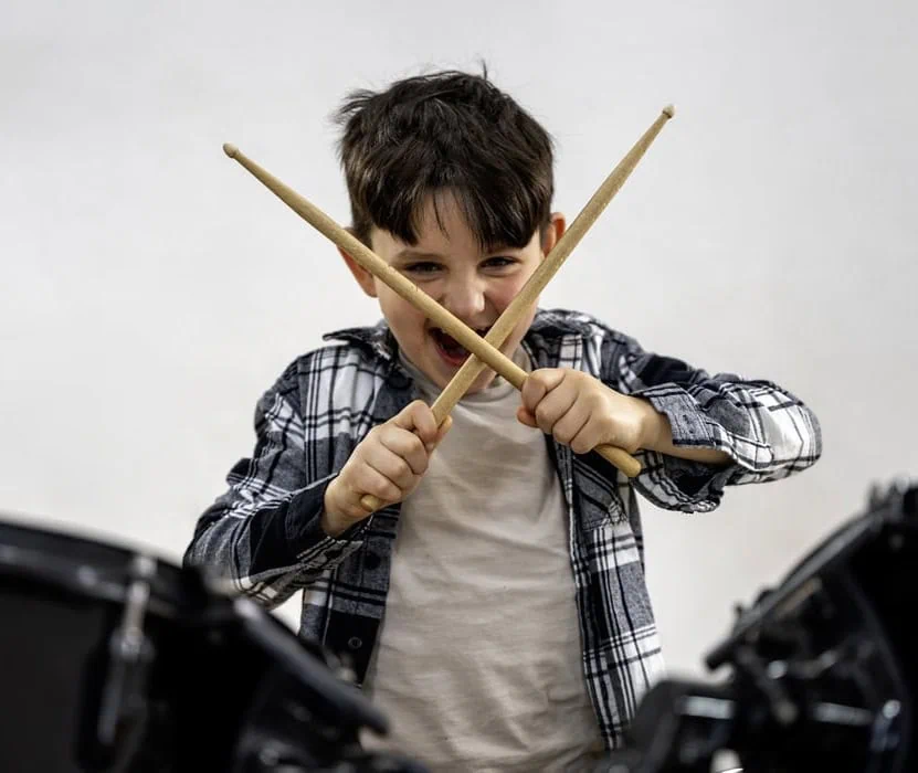 boy playing drums